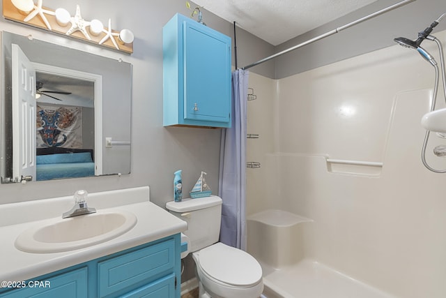 bathroom featuring vanity, ceiling fan, toilet, a textured ceiling, and a shower with curtain