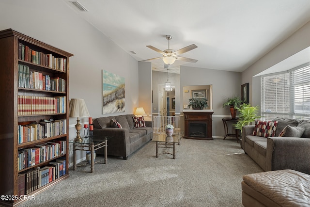 living room with lofted ceiling, carpet floors, and ceiling fan