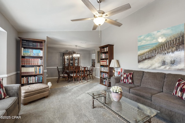 living room featuring lofted ceiling, ceiling fan, and carpet