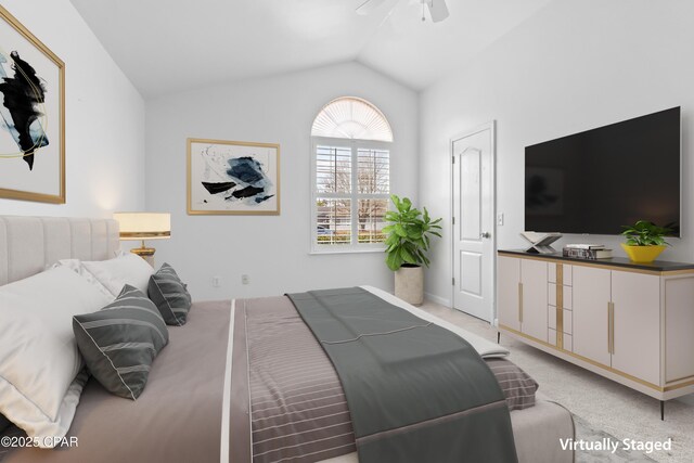 unfurnished room featuring vaulted ceiling, light carpet, and ceiling fan