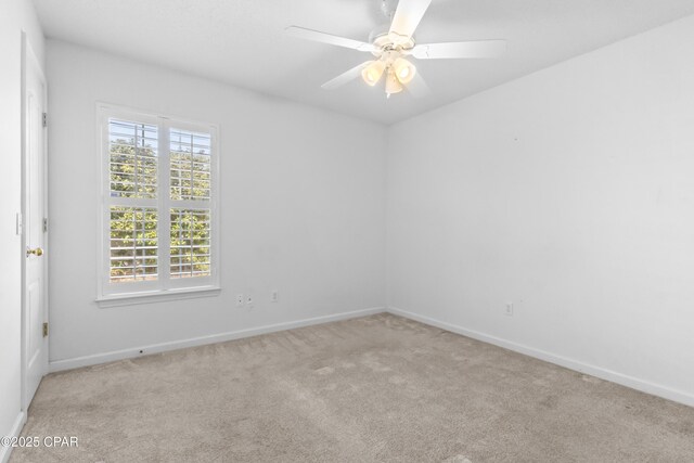 carpeted empty room with ceiling fan