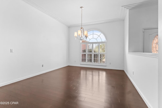 unfurnished dining area featuring crown molding, dark hardwood / wood-style floors, and a chandelier