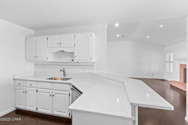 kitchen with tasteful backsplash, white cabinets, and appliances with stainless steel finishes