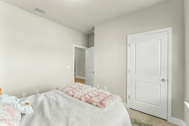 bedroom with visible vents and baseboards