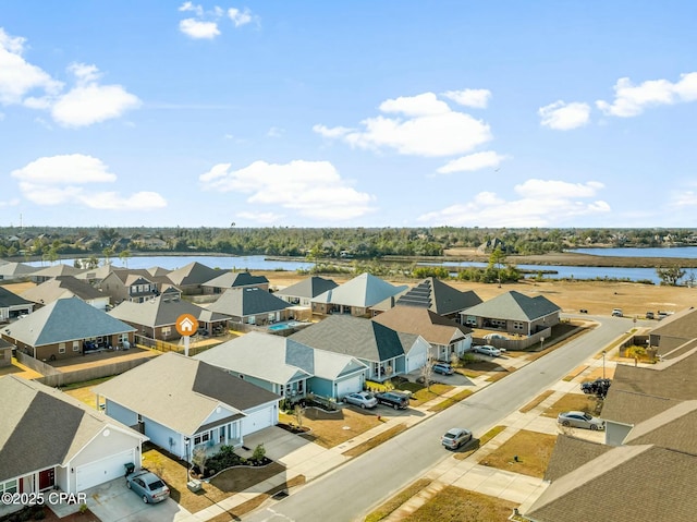 aerial view with a water view and a residential view