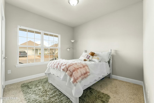 bedroom featuring carpet, vaulted ceiling, and baseboards