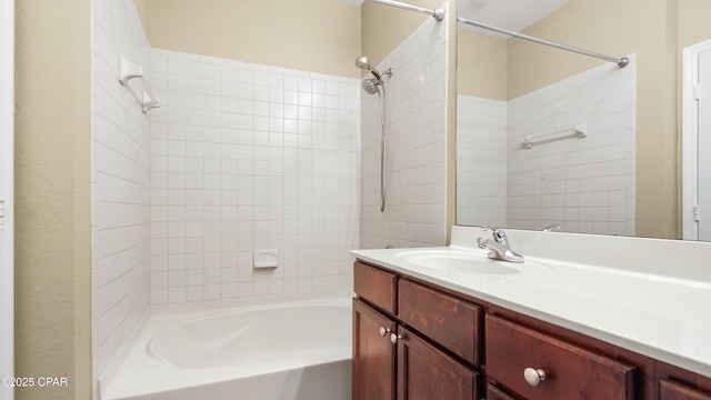 bathroom featuring vanity and tiled shower / bath combo