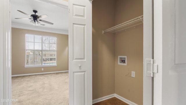 laundry room with hookup for a washing machine, crown molding, light colored carpet, and ceiling fan