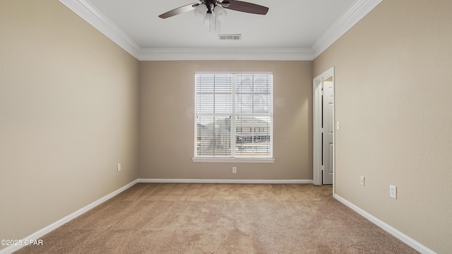 unfurnished room featuring crown molding, light carpet, and ceiling fan