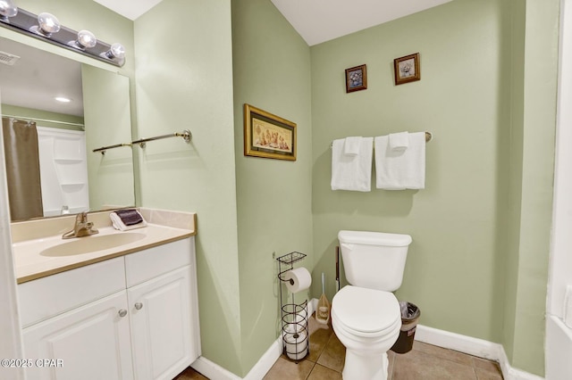full bathroom featuring baseboards, toilet, and tile patterned flooring