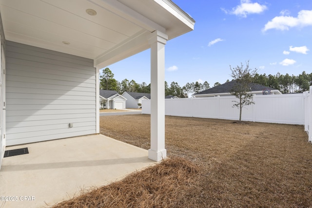 view of yard with a patio and fence