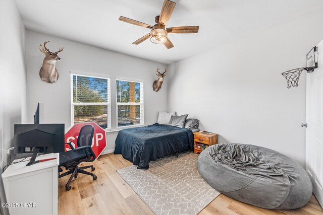 bedroom featuring hardwood / wood-style flooring and ceiling fan