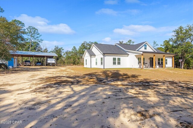 view of front of home featuring a porch and a carport