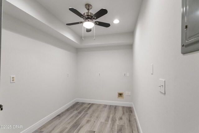 washroom featuring electric panel, ceiling fan, and light wood-type flooring