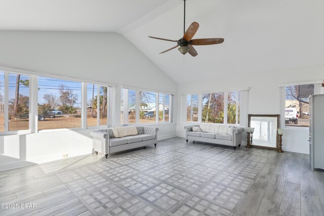 unfurnished sunroom with vaulted ceiling and ceiling fan