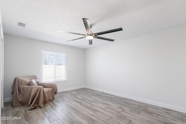 unfurnished room featuring light hardwood / wood-style floors and ceiling fan