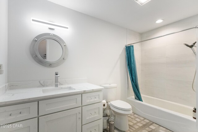 full bathroom featuring vanity, shower / tub combo, and toilet