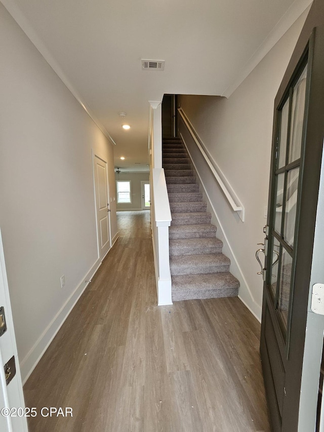 239 Skylah Ln Unit 20, Panama City Beach, FL 32407 - stairs with ornamental molding, baseboards, wood finished floors, and recessed lighting