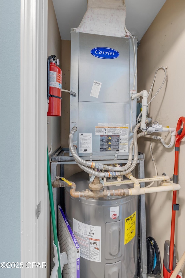 utility room featuring heating unit