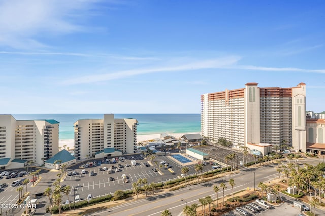 aerial view with a water view and a view of the beach