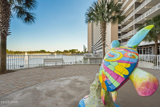 surrounding community featuring a water view