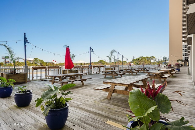 wooden terrace with a water view