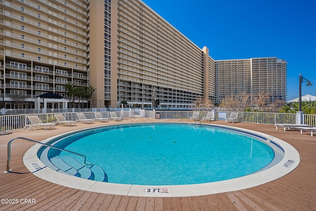 view of swimming pool with a patio area