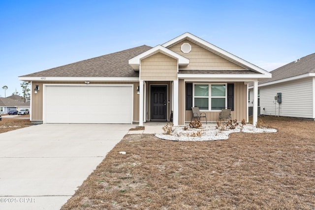 view of front of property featuring a garage and covered porch