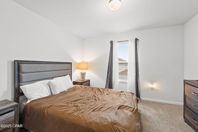 bedroom featuring light carpet