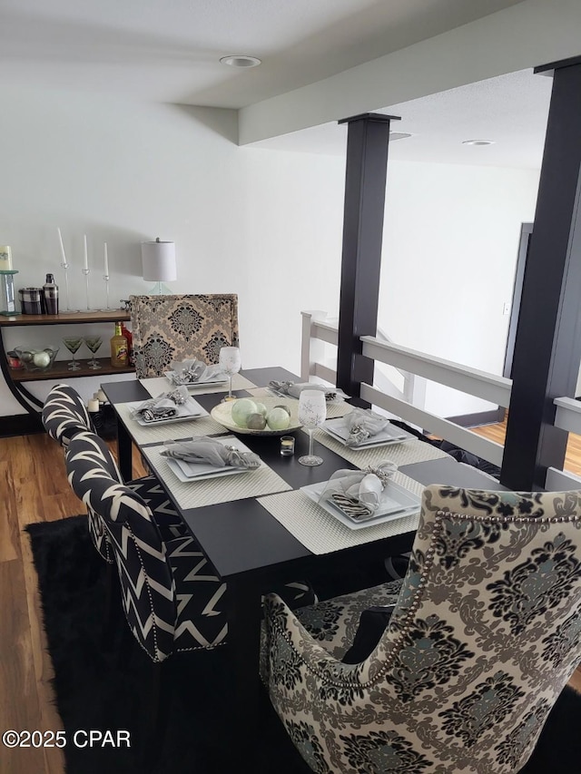 dining space with hardwood / wood-style floors