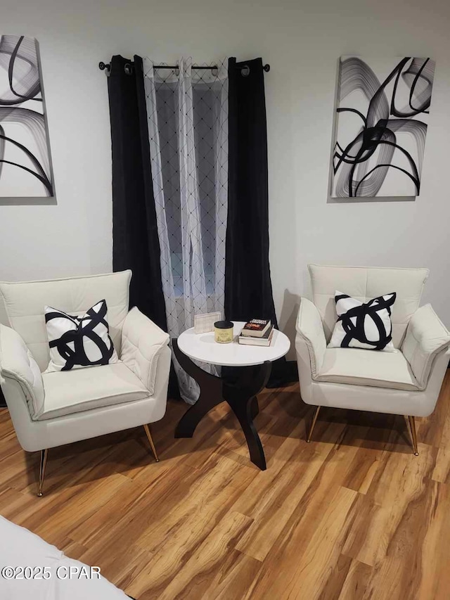 sitting room featuring hardwood / wood-style floors