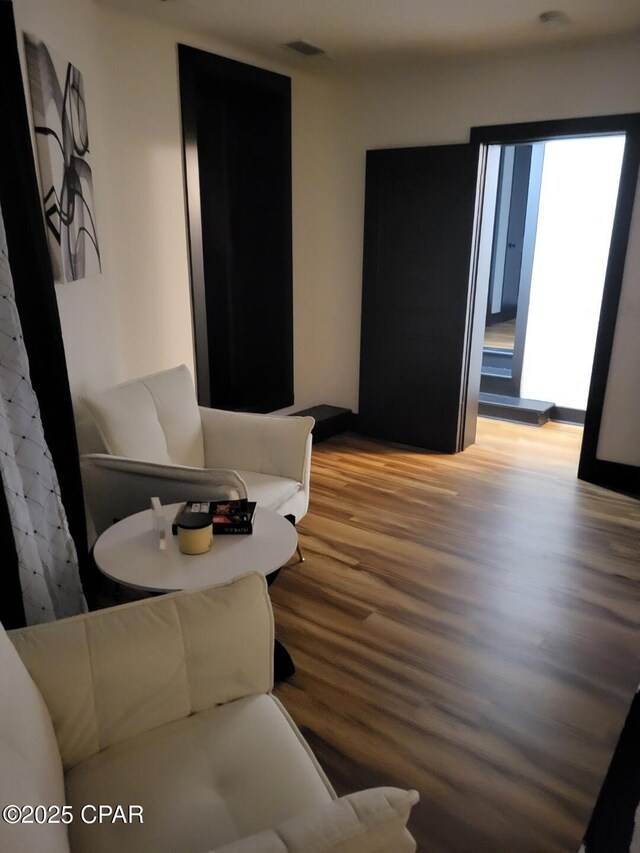 living room with light hardwood / wood-style flooring