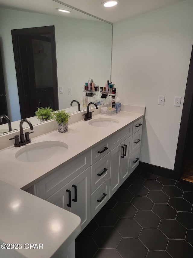 bathroom with tile patterned flooring and vanity