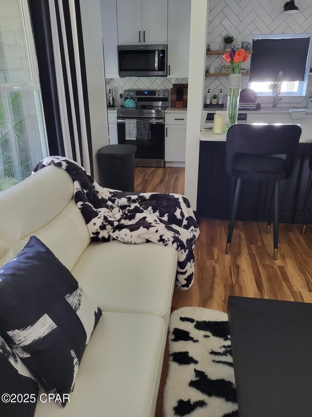 living room with dark wood-type flooring