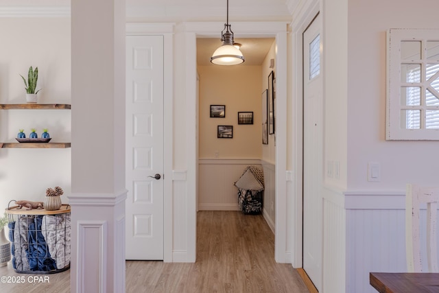 corridor with light hardwood / wood-style flooring