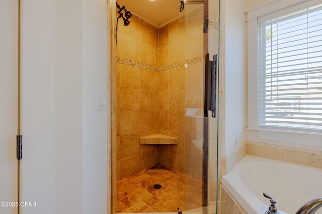 bathroom with separate shower and tub