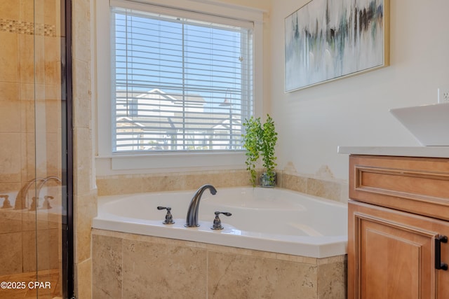 bathroom featuring sink and separate shower and tub