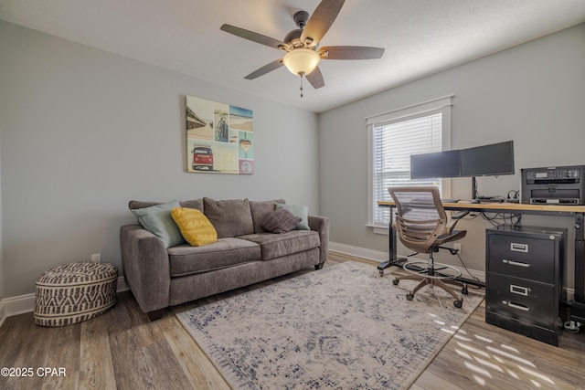 home office with hardwood / wood-style floors and ceiling fan