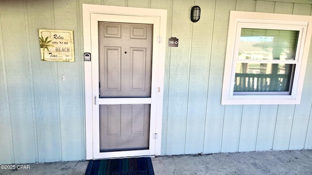 doorway to property with board and batten siding