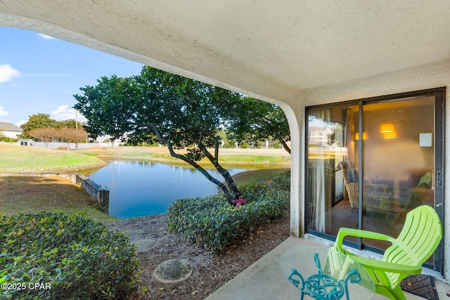 view of patio / terrace featuring a water view