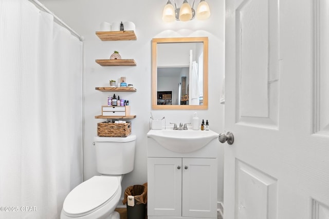 bathroom featuring vanity and toilet