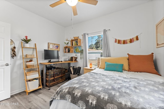 bedroom with ceiling fan and light hardwood / wood-style flooring