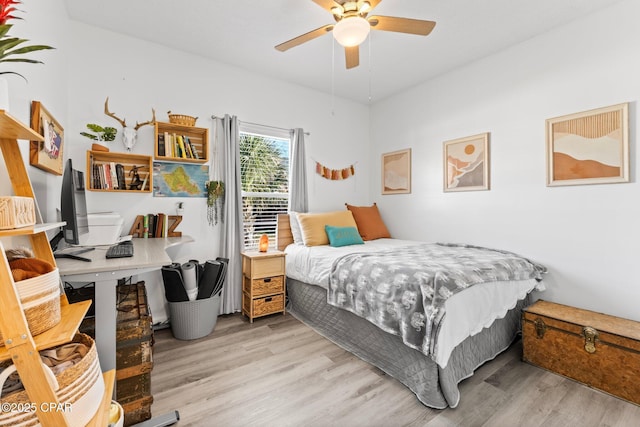 bedroom featuring ceiling fan and light hardwood / wood-style flooring