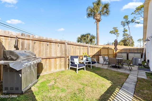 view of yard featuring cooling unit and a patio