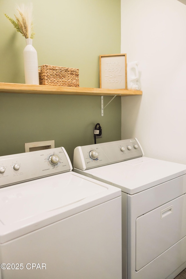 clothes washing area featuring washing machine and dryer