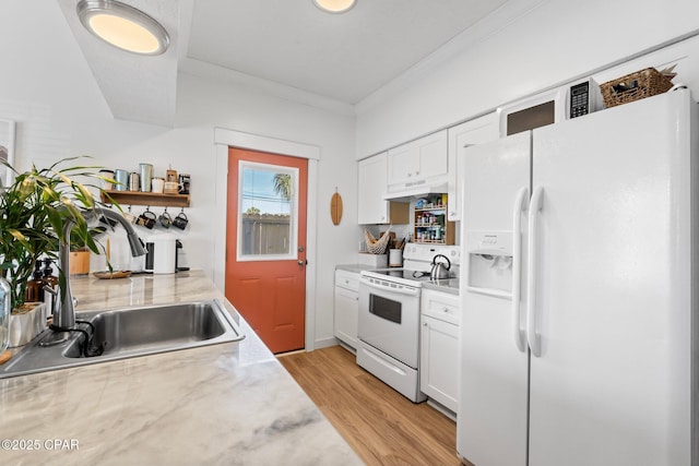 kitchen featuring sink, white cabinetry, ornamental molding, white appliances, and light hardwood / wood-style floors