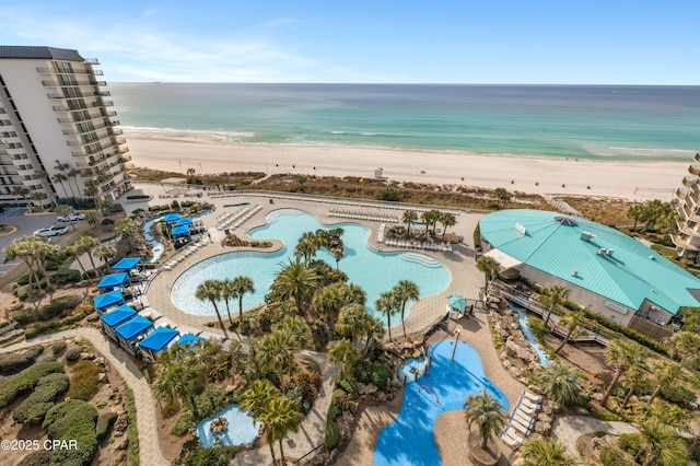 bird's eye view featuring a water view and a view of the beach