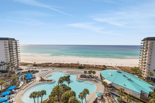 bird's eye view featuring a water view and a beach view