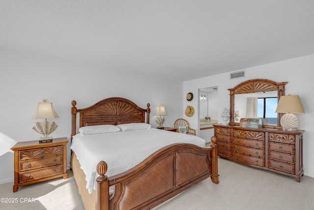 bedroom featuring visible vents