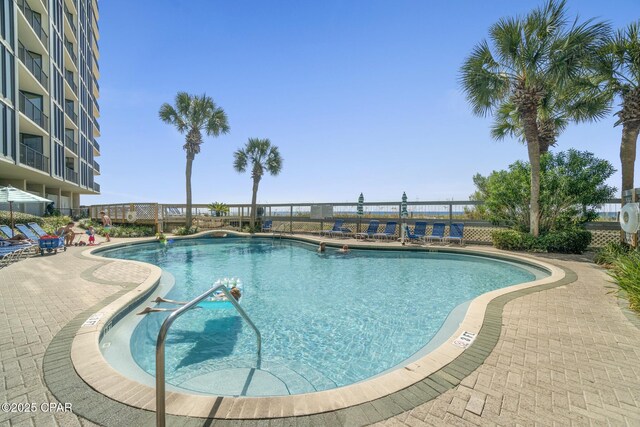 deck with a water view and a beach view